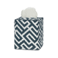 Elevate your bathroom decor with the Matouk Gabriel Tissue Box Cover Collection, featuring a stylish geometric navy and white Schumacher print with a tissue partially pulled out from the top.
