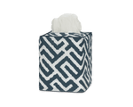 Elevate your bathroom decor with the Matouk Gabriel Tissue Box Cover Collection, featuring a stylish geometric navy and white Schumacher print with a tissue partially pulled out from the top.