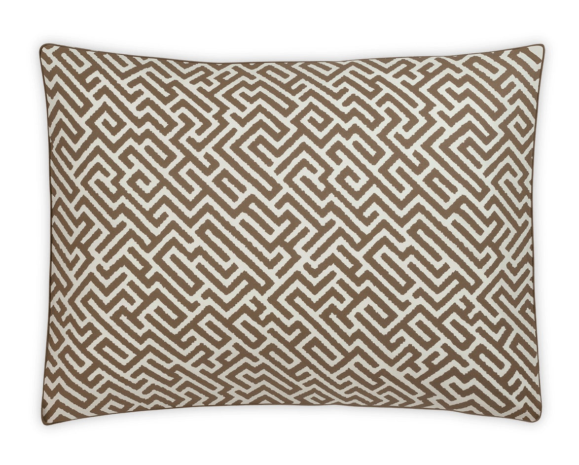Rectangular pillow from the Gabriel Bedding Collection by Matouk, featuring a brown and white geometric maze pattern inspired by Schumacher print, shown from above against a white background.