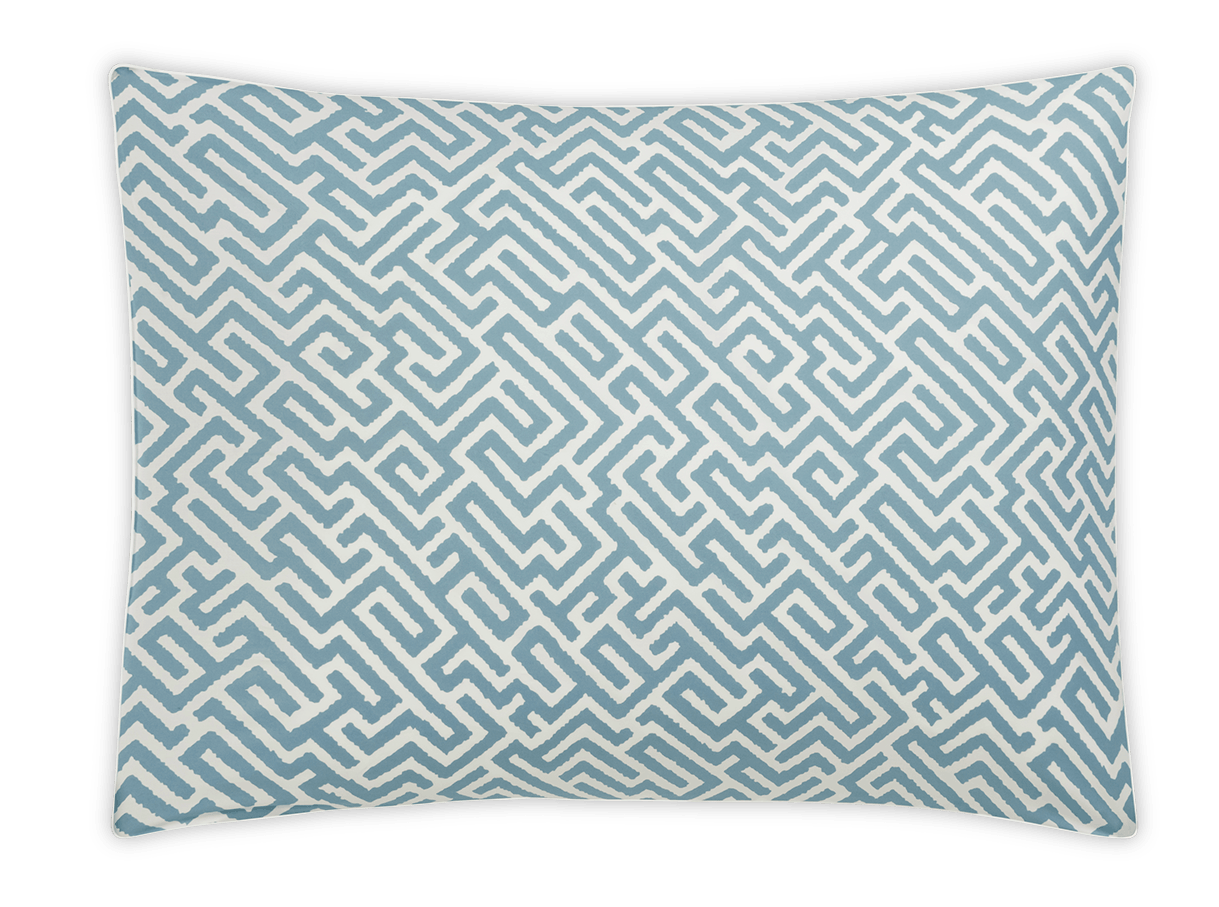 The Gabriel Bedding Collection in Stony Blue by Matouk features a rectangular pillow with a white background and light blue maze-like geometric pattern—ideal for adding a sophisticated geometric touch to your bedding.