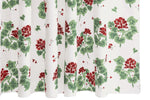 The Geranium Shower Curtain Collection by Matouk features a white backdrop with green leaves and red floral clusters, inspired by the Tillett design and repeated across crisp percale fabric.