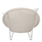 Rear view of Janus et Cie’s Lounge Chair in Schooner Snow: a round, handwoven stainless steel beige chair with a white cushion and metal hairpin legs—ideal for luxury interiors.