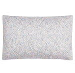 The Enchanted Wildflowers Toddler Pillow by Gooselings features a subtle pastel floral design on a light background, making it an adorable and cozy addition to any child's bedding.