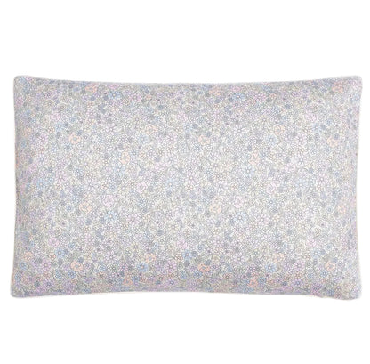 The Enchanted Wildflowers Toddler Pillow by Gooselings features a subtle pastel floral design on a light background, making it an adorable and cozy addition to any child's bedding.
