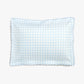 The Gooselings Blue Picnic Gingham Bedding Collection rectangular pillow features a light blue and white gingham pattern with scalloped edges, crafted from pure materials that are OEKO-TEX certified, photographed on a plain white background.