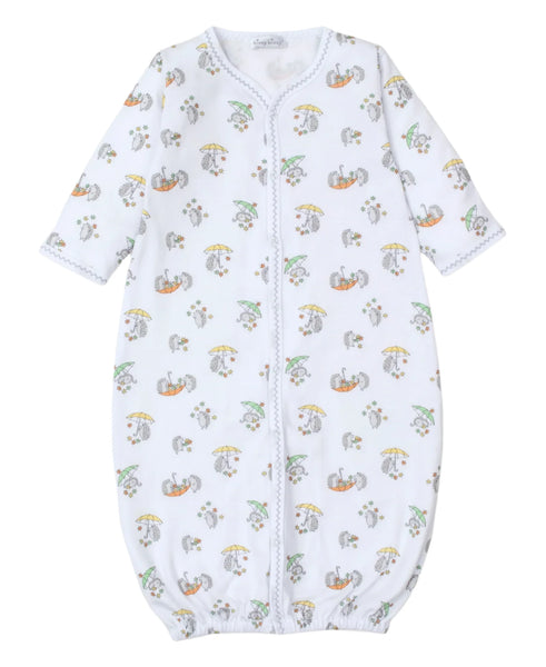 The Kissy Kissy Hedgehog Fall Showers Printed Convertible Gown by Kissy Kissy is a white baby sleep sack with long sleeves, crafted from soft Pima cotton. It features colorful printed patterns of animals holding umbrellas, with a front zipper and an elasticized bottom accentuated by hedgehogs in the fall showers print.