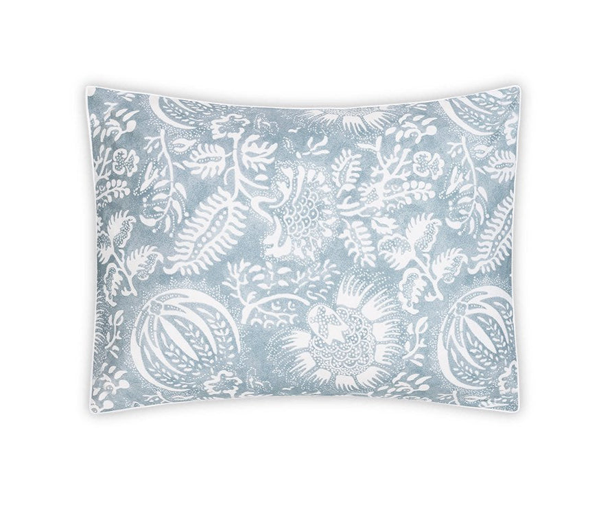 The Granada Bedding Collection in Hazy Blue by Matouk features a rectangular pillow with a blue and white pomegranate print on Egyptian cotton percale, shown against a white background.