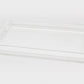 The Tizo Design Acrylic Tray with Bubble Handles Collection features a clear rectangular tray with raised edges and bubble handles at each end, ideal for serving at gatherings. Shown here against a plain white background.