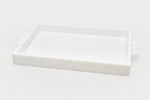 The Acrylic Tray with Bubble Handles Collection by Tizo Design features a rectangular white acrylic tray with raised edges and bubble handles, designed for stylish home gatherings and displayed on a plain white background.