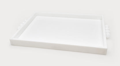 The Tizo Design Acrylic Tray with Bubble Handles Collection features a rectangular white acrylic tray with raised sides and unique bubble handles, perfect for serving at home gatherings. Shown on a plain white background.
