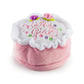 The Haute Diggity Dog Birthday Girl Toy is a round, plush dog toy with pink sides, a white top, "Birthday Girl" embroidery, and fabric flowers—perfect for your pup’s birthday celebration.