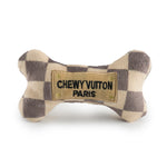 The Haute Diggity Dog Checker Chewy Vuiton Bone is a plush, squeaky dog toy with a checkered pattern and "CHEWY VUITON PARIS" patch—perfect for adding style to your pup’s playtime.
