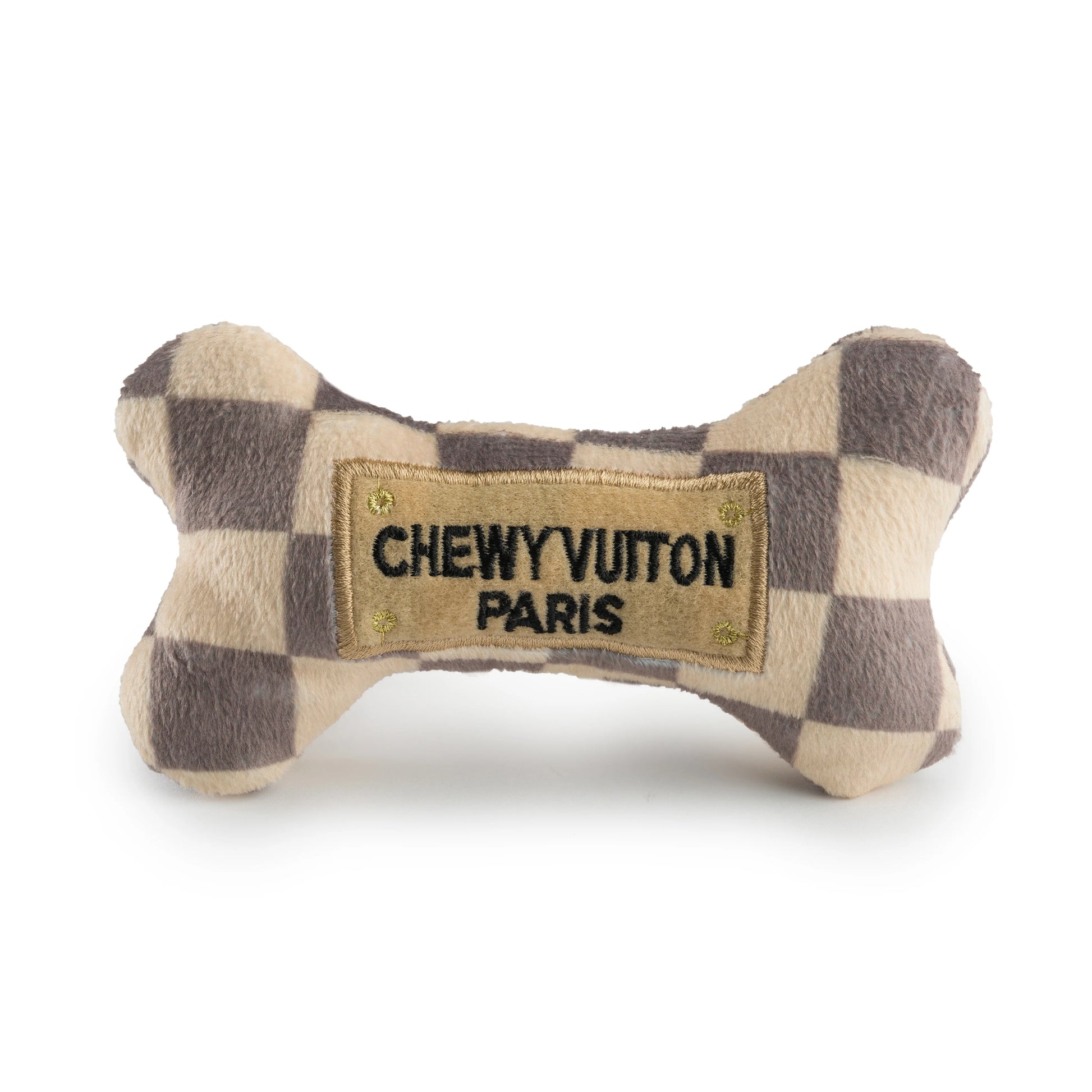 The Haute Diggity Dog Checker Chewy Vuiton Bone is a plush, squeaky dog toy with a checkered pattern and "CHEWY VUITON PARIS" patch—perfect for adding style to your pup’s playtime.