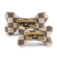 The Haute Diggity Dog Checker Chewy Vuiton Bone is a plush squeaky dog toy with a chic checkered pattern and "Chewy Vuiton Paris" label—perfect for pampered pups who love stylish playtime.