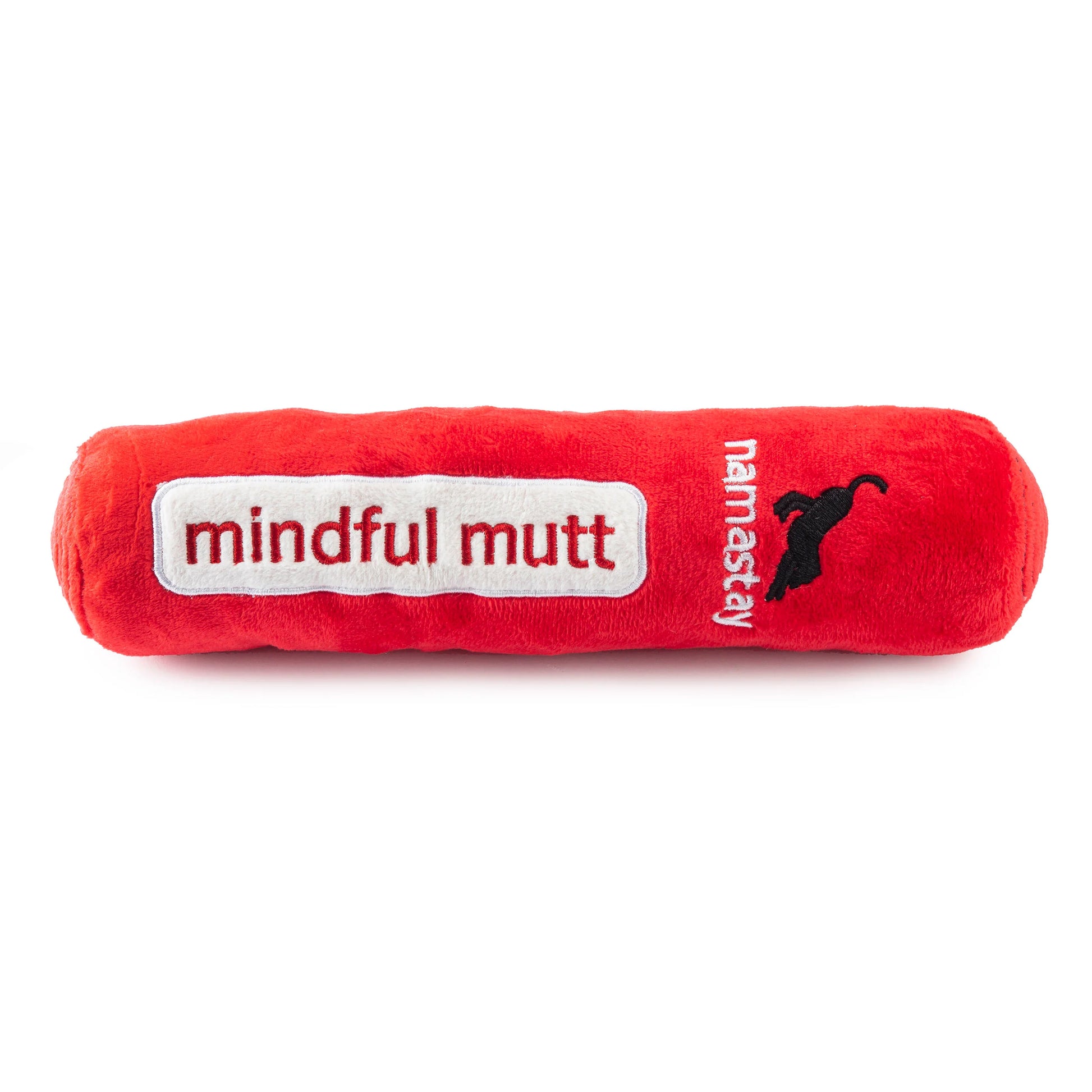 The Chewlulemon Yoga Mat Dog Toy by Haute Diggity Dog is a red plush toy featuring "mindful mutt" embroidered in white and "namastay" with a dog silhouette on the side, inspired by a yoga mat.