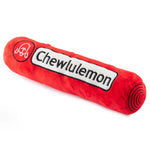 The Haute Diggity Dog Chewlulemon Yoga Mat Dog Toy is a red plush log with "Chewlulemon" and a circular logo on a white patch—ideal for pups who love quirky, yoga-inspired toys.