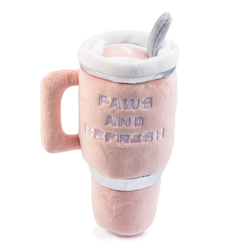 The Haute Diggity Dog Snuggly Cup Dog Toy, Blush, is a plush travel mug-shaped toy with a handle and spoon, featuring "PAWS AND REFRESH" embroidery—an adorable squeaky toy perfect for your pup's playtime.