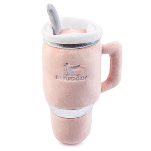 The Snuggly Cup Dog Toy in blush by Haute Diggity Dog features a travel mug design with a handle, lid, spoon, and embroidered logo—making this adorable plush tumbler toy perfect for playful pups.