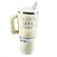 The Snuggly Pup Plush Toy by Haute Diggity Dog is an ivory dog toy shaped like a coffee cup with a handle and a toy straw, featuring "PAWS AND REFRESH" embroidered on the front—a cute tumbler toy for your pup.