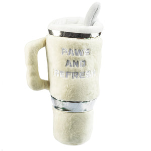 The Snuggly Pup Plush Toy by Haute Diggity Dog is an ivory dog toy shaped like a coffee cup with a handle and a toy straw, featuring "PAWS AND REFRESH" embroidered on the front—a cute tumbler toy for your pup.