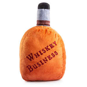 The Woofford Reserve Bourbon Dog Toy by Haute Diggity Dog is a plush whiskey bottle-shaped toy with "Whiskey Business" in red—ideal for pups craving a playful bourbon-themed chew!.
