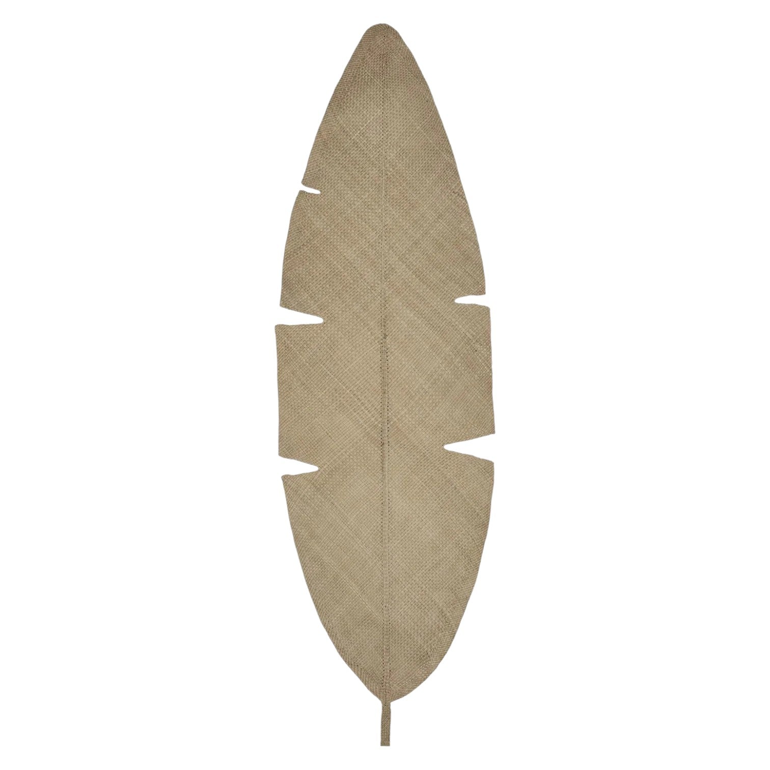 The Mythic Ecosystem Table Mat Collection by Johanna Ortiz features a beige, textured, elongated leaf with deep notches, reminiscent of artisanal Iraca palm mats, elegantly displayed on a white background.