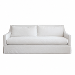 The Hannah Condo Sofa in Nit Witty Sea Salt by Verellen is a three-seat white sofa featuring straight arms, a tailored skirt, and two back cushions in a Sea Salt finish, shown against a plain white background. This compact design combines style and comfort, making it ideal for modern living spaces.