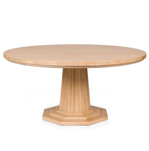 The Haven Dining Table by Bunny Williams features a large cerused oak round top, fluted pedestal base, and an octagonal platform, shown against a white background.