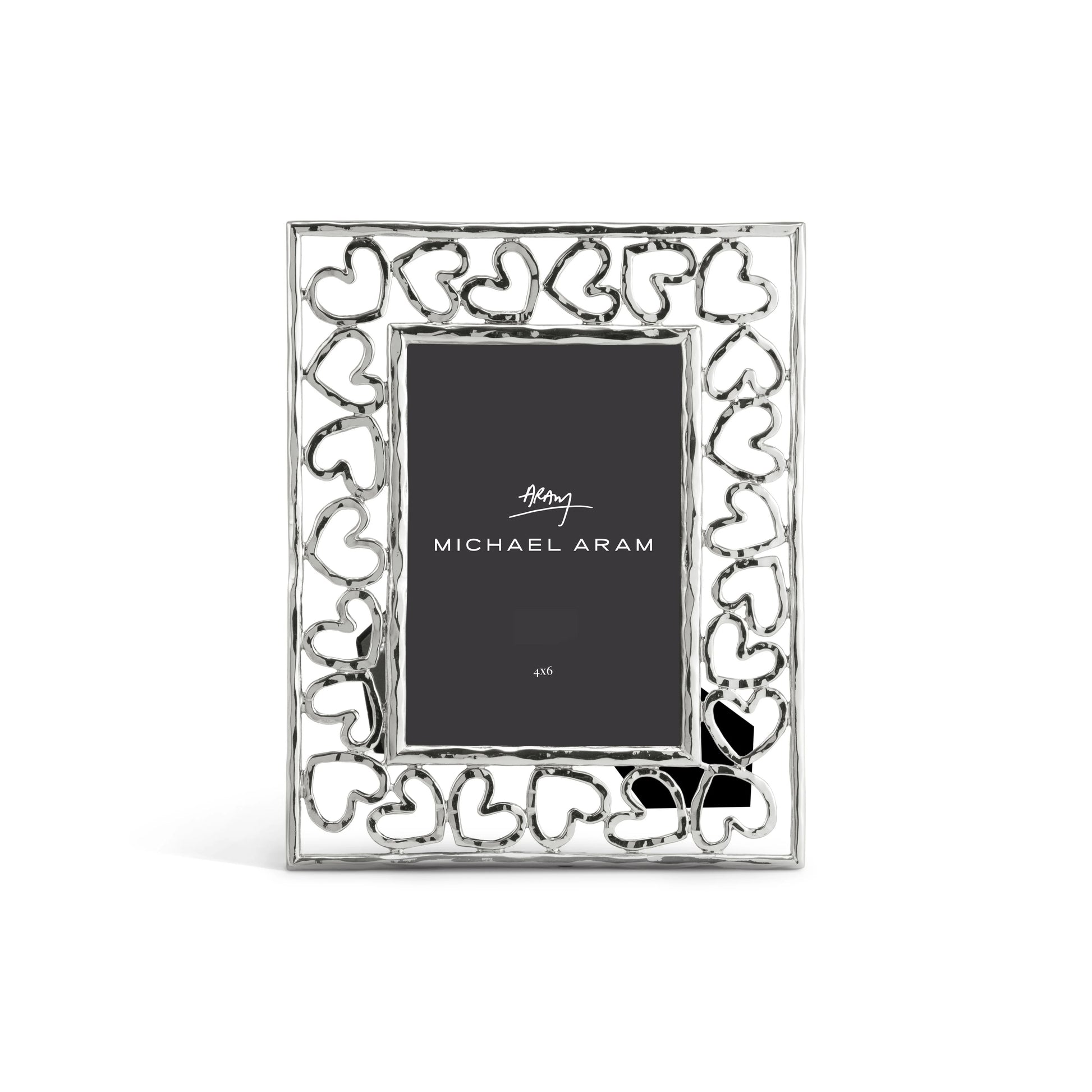 The Michael Aram Heart Frame features a hand-forged look with interlocking heart shapes as a symbol of love, and displays a 4x6 inch "Michael Aram" placeholder card.