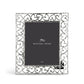 The Michael Aram Heart Frame features a silver border of interlocking, hand-forged hearts as a symbol of love and includes a "Michael Aram" placeholder card at its center.