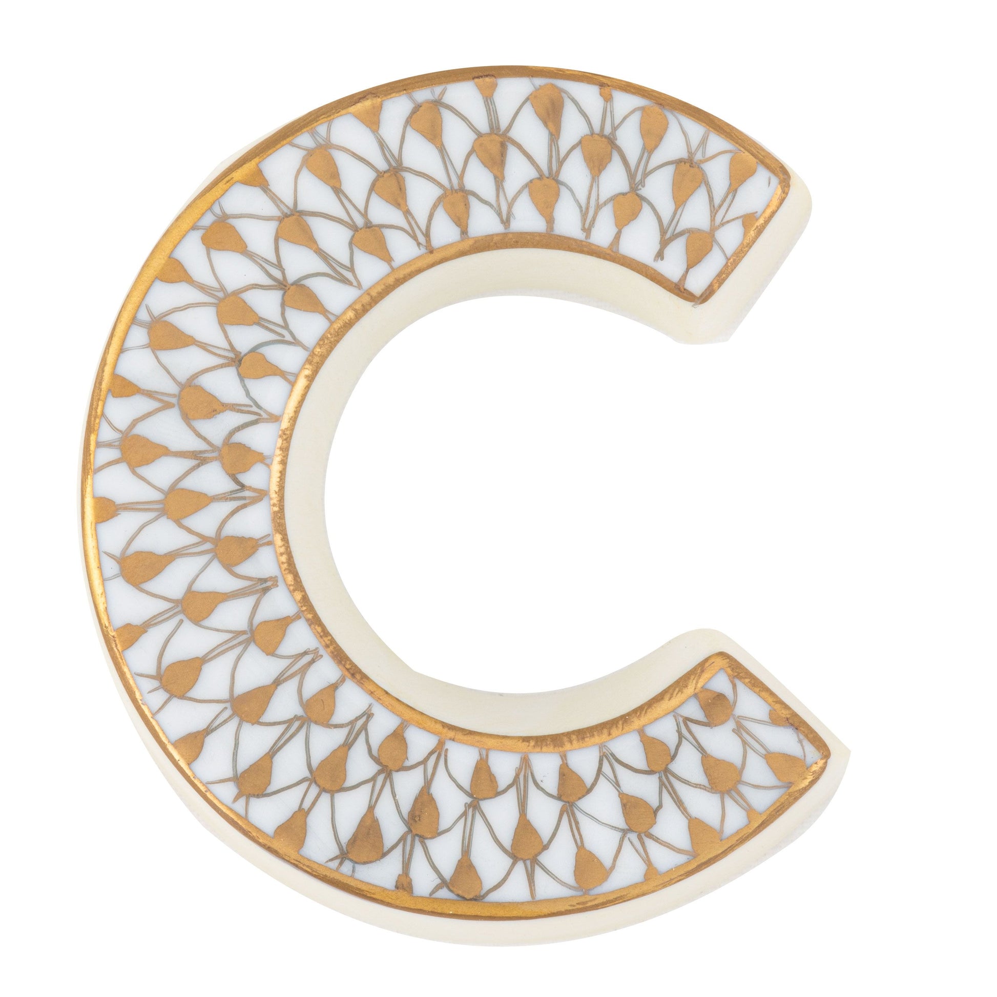 The Herend Letters collection features a ceramic letter "C" with a white base and gold leaf pattern, highlighting the artistry of hand-painted design.