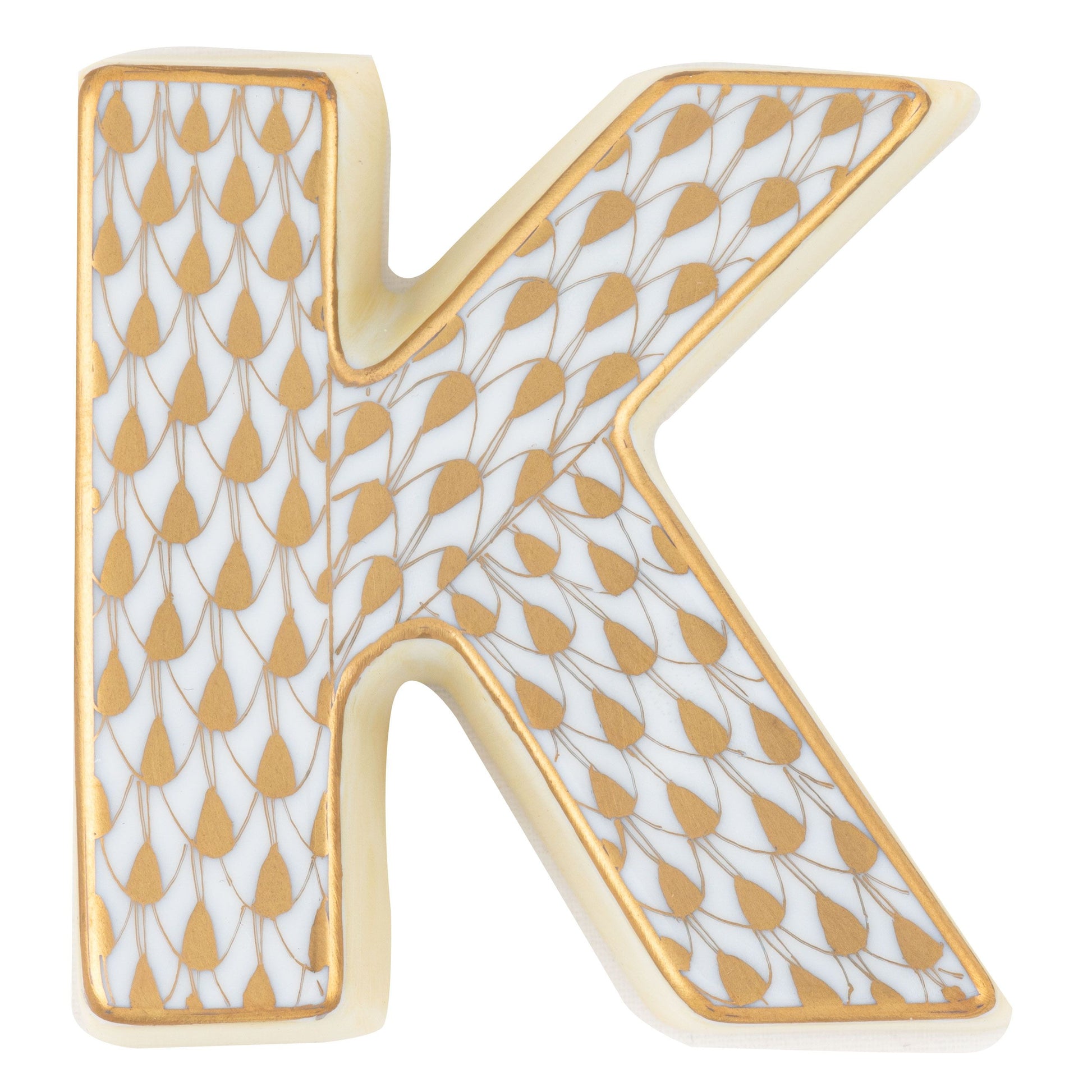 Herend Letters: A decorative letter "K" featuring a gold leaf-shaped pattern outlined in black on a white background, evoking hand-painted artistry and inviting admiration.