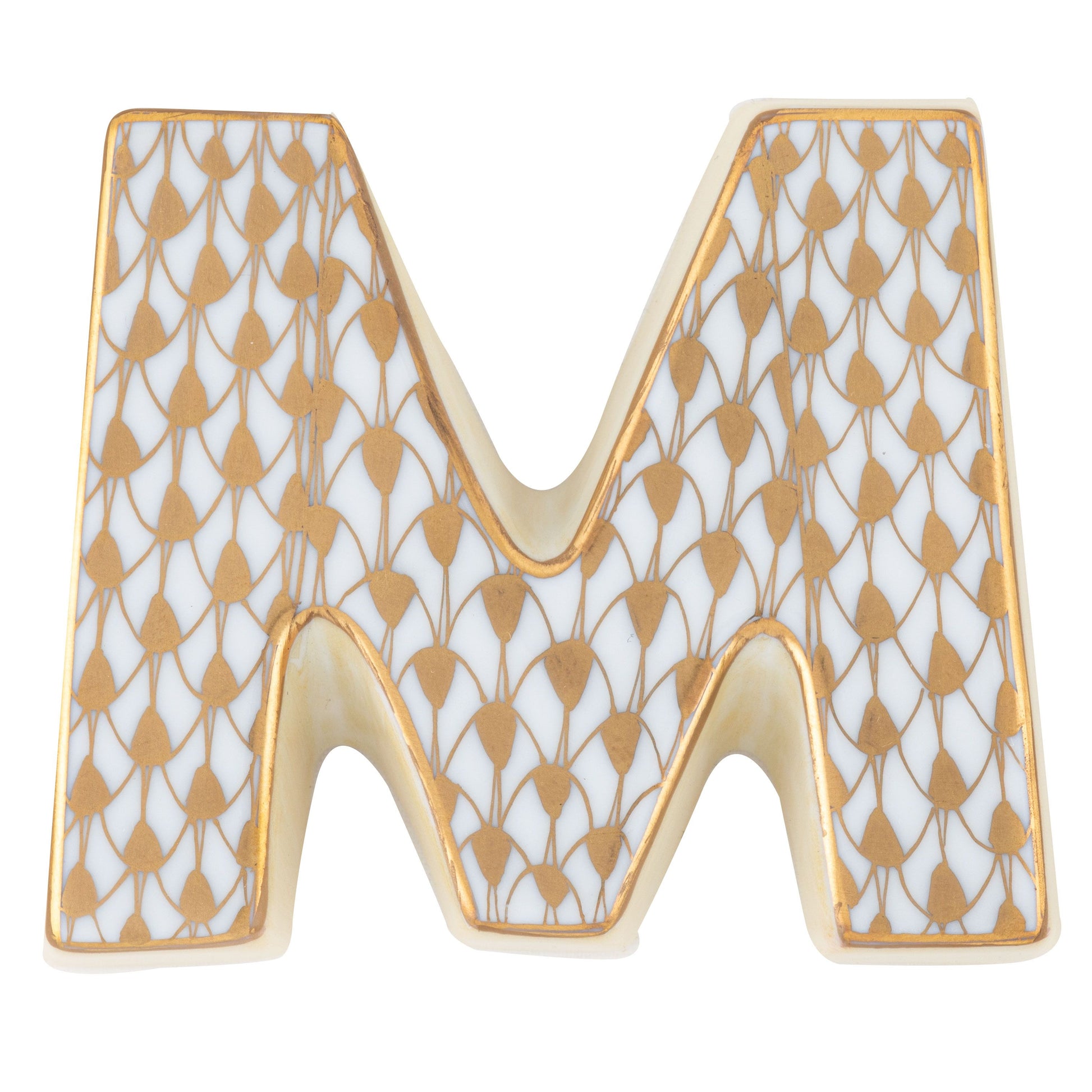 The Herend Letters ceramic "M" features a white base with hand-painted gold teardrop patterns outlined in gold, ideal for artistic appreciation.