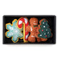 Foggy Dog's Christmas Cookies Dog Toys Gift Set includes four festive squeaker toys—a snowflake, candy cane, gingerbread person, and Christmas tree—packaged in a black box for holiday fun.