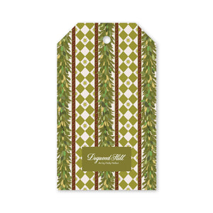 Charleston Etoile gift tag featuring a rectangular shape with a repeating green and white diamond pattern, vertical evergreen garlands, and small star icons.