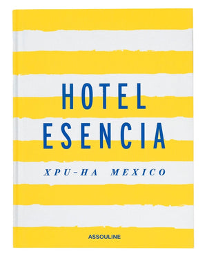 The cover of "Hotel Esencia" by Assouline exudes understated luxury, featuring blue text on a yellow and white striped background that captures the essence of Riviera Maya.