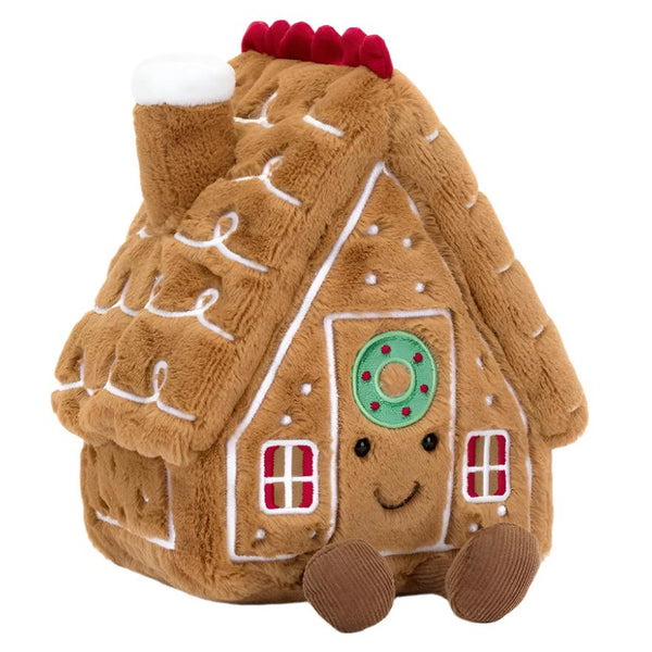 Introducing the Jellycat Amuseables Gingerbread House, a cuddly house-shaped delight from the beloved Jellycat brand. This charming creation features a smiling face, a red and white chimney, and adorable brown feet. Adorned with white icing-like designs and cheerful red window details, it's perfect for party time or cozy cuddles!