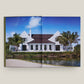 An open book, "House Love: Moor Baker Architects" by Vendome, displays a white house with a dark roof amid palm trees and a pond beneath a blue sky, highlighting Florida’s classical architecture.