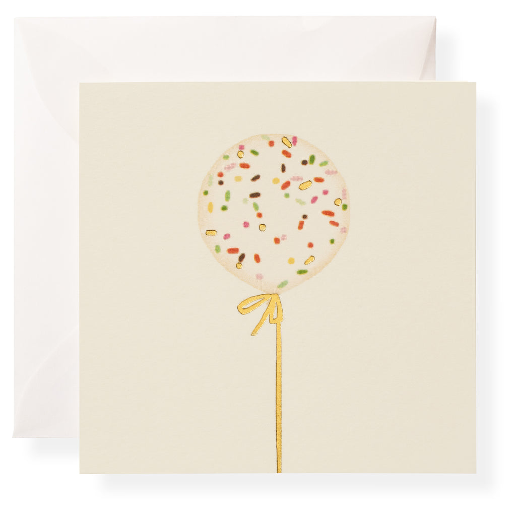 The Karen Adams "Make A Wish Gift Enclosures" features a square card with a sprinkle balloon and gold ribbon on cream, highlighted with gold foil details, and includes a white envelope.