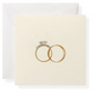 The Karen Adams Just Married Gift Enclosures feature a cream-white card with two gold rings—one with a diamond—set against a white envelope. Their elegant design is ideal for adding charm to any special occasion.
