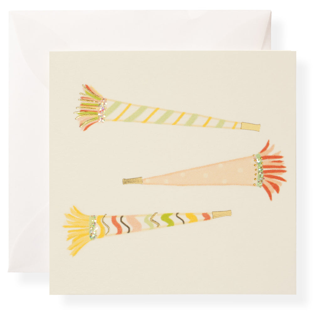 The Karen Adams Make A Wish Gift Enclosures feature three illustrated party blowers with colorful patterns, gold foil accents, and fringe on a cream background, paired with a white envelope.