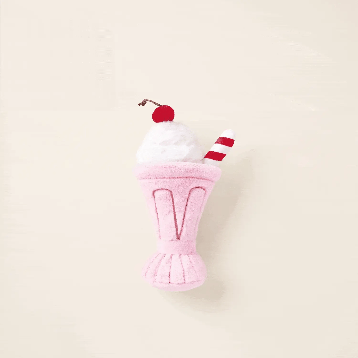The Foggy Dog Strawberry Milkshake Snuffle Dog Toy features a pink milkshake design with white whipped cream, a red cherry, and a striped straw—perfect for playful pups and fun playtime.