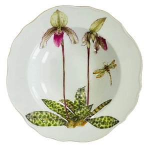The Anna Weatherley Orchid III Dinnerware Collection dinner plate features two hand-painted orchids, a dragonfly, green leaves at the base, and a scalloped edge.