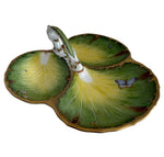 The Anna Weatherley Leaf Tray is a hand-painted Hungarian porcelain serving dish featuring three leaf-shaped sections, butterfly and insect motifs, gold edging, and a central handle.