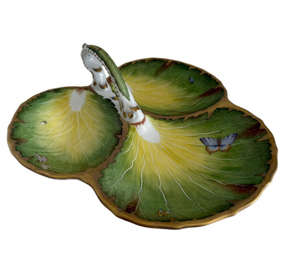 The Anna Weatherley Leaf Tray is a hand-painted Hungarian porcelain serving dish featuring three leaf-shaped sections, butterfly and insect motifs, gold edging, and a central handle.