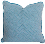 The Lombok Lagon Outdoor Pillow by Hive Custom Pillows is a handmade, blue decorative pillow featuring a woven geometric pattern and braided edge, filled with poly fill for added comfort. Made in the USA.