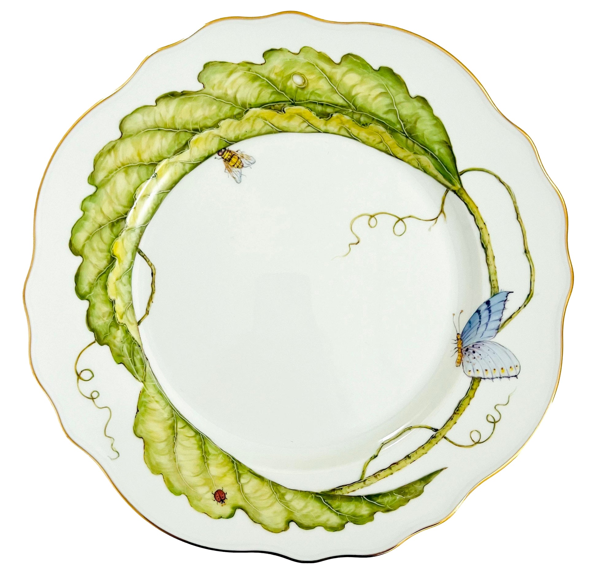 Hand-painted by Anna Weatherley, this Garden Leaves Dinnerware Collection plate features wavy white porcelain, green leaves, a butterfly, bee, ladybug, and a thin gold rim.