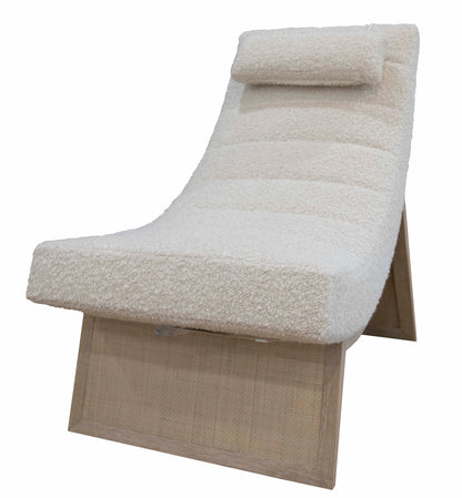 A modern, angular Sway Lounge Chair by McGuire Furniture with a wooden base and cushioned seat upholstered in neutral boucle fabric, featuring a rectangular headrest.