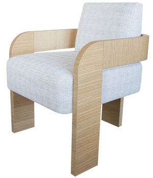A modern armchair with light wood armrests and legs, featuring a white cushioned seat and backrest wrapped in Form Arm Chair by Vanguard fabric.