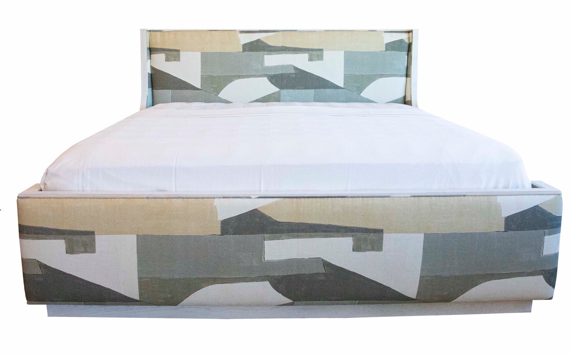 The Highland House Gustav Bed, King, is a modern masterpiece with an upholstered headboard and footboard, showcasing a geometric pattern in shades of gray, green, and beige, complemented by subtle wood details and pristine white bedding.